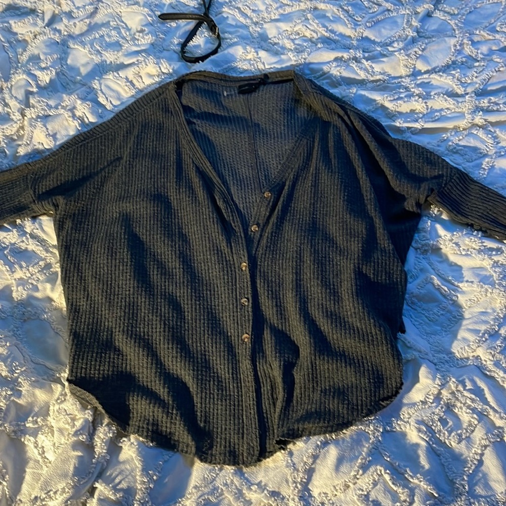 Out from under gray cardigan/baggy top